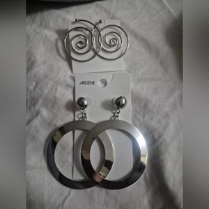 2 silver tone earrings